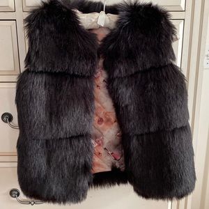 European size 150 black fur vest